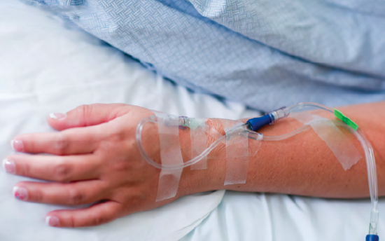 Patient's arm with working IV, a skill taught in our Phlebotomy School teaching medical laboratory services provided in Boise, Garden City, Meridian, Idaho Falls, Pocatello and Rexburg 